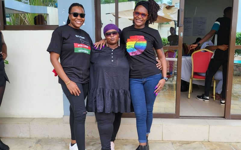 Community members engaging in advocacy and support activities, promoting rights and well-being in a vibrant setting in Mombasa, Kenya.